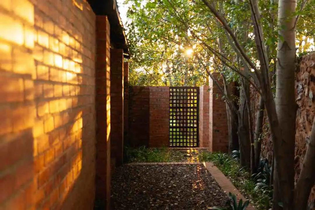 View of side alley of cottage verandah.