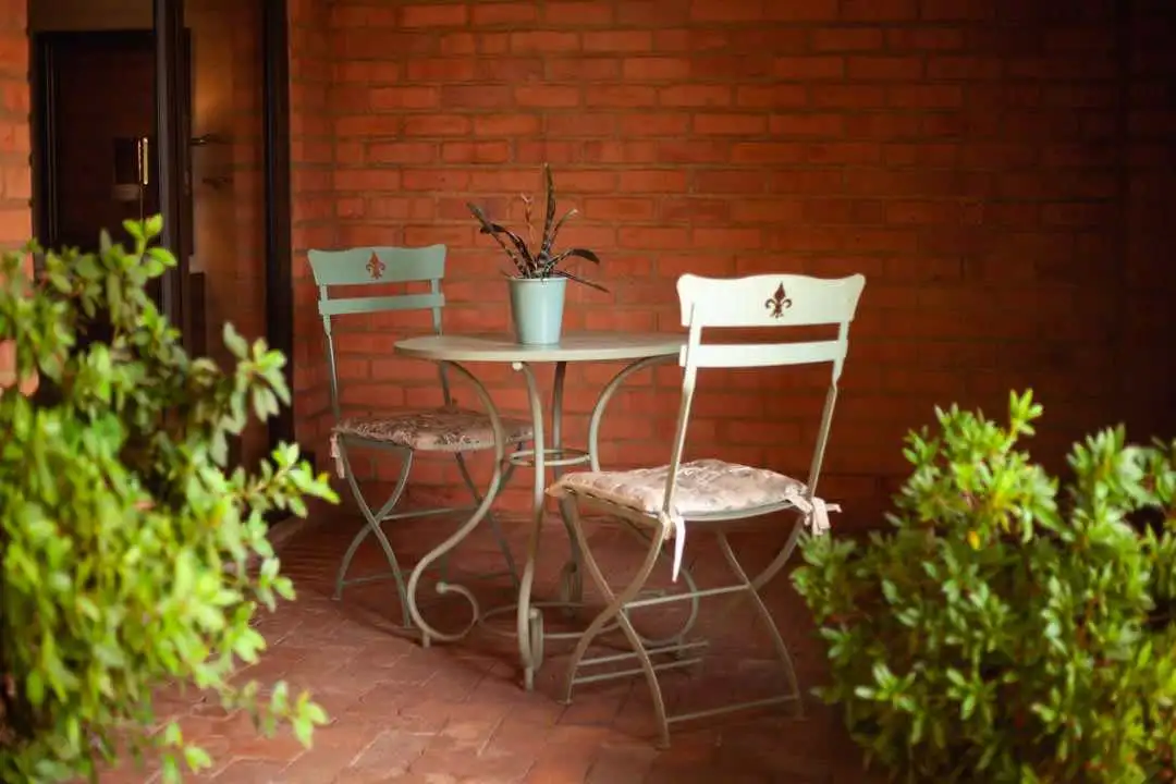 A view of the small table and chairs on the downstairs verandah.
